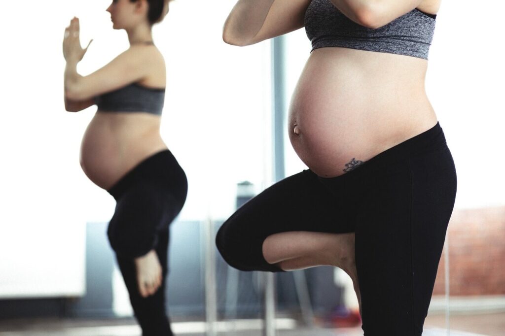 pregnant woman in standing tree pose
